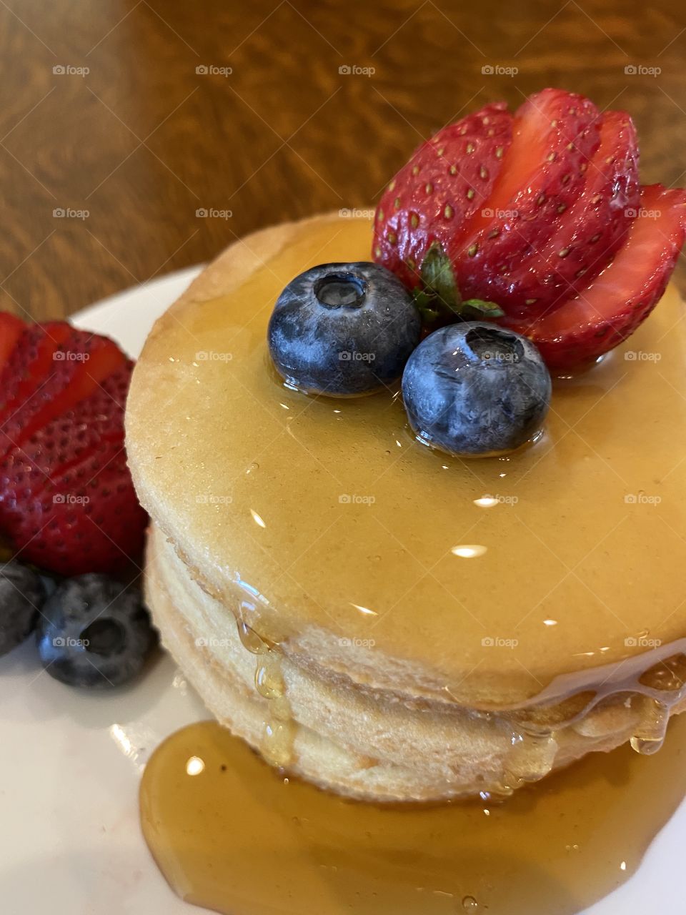 Delicious looking dessert with yummy fruits including strawberries and blueberries!! 