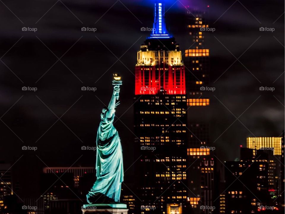 Statue of Liberty and Empire State both in one photo