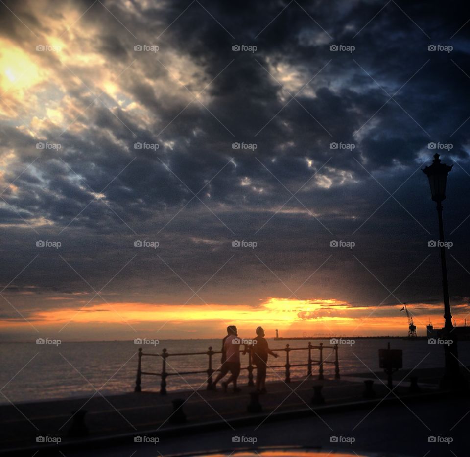 Evening walking. Best time to walk by the sea