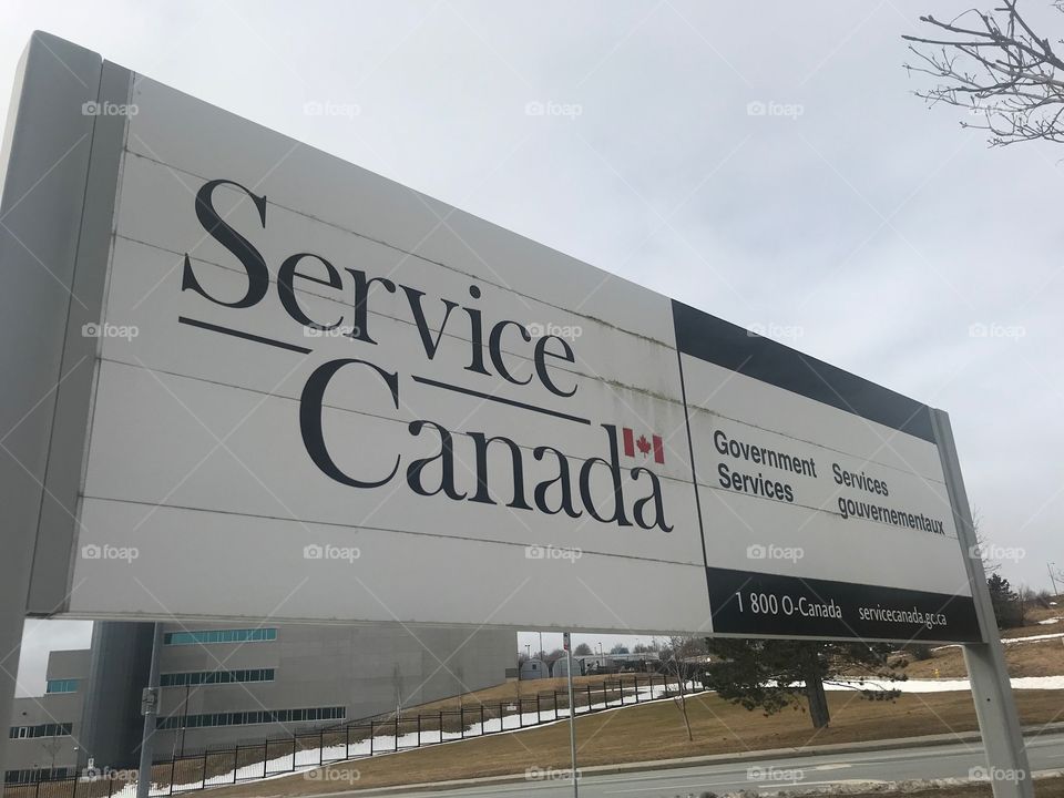 This is a sign for service Canada, a department of the government of Canada that provides services such as 1) the Canadian job skills grant, 2) apprenticeship programs 3) EI (employment insurance). Taken in the east end of St. John’s NL Canada 