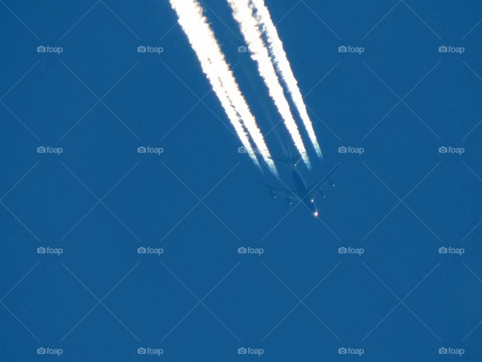 Airplane with contrails