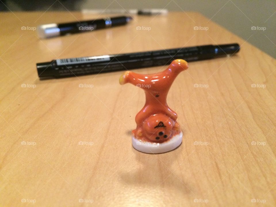 Handstand figurine, playful view of my table edge at work. Fun little gift I got