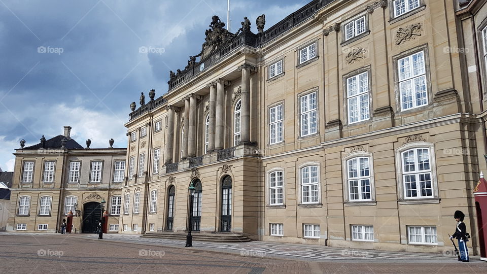 Amalienborg place with guards in Copenhagen, Denmark