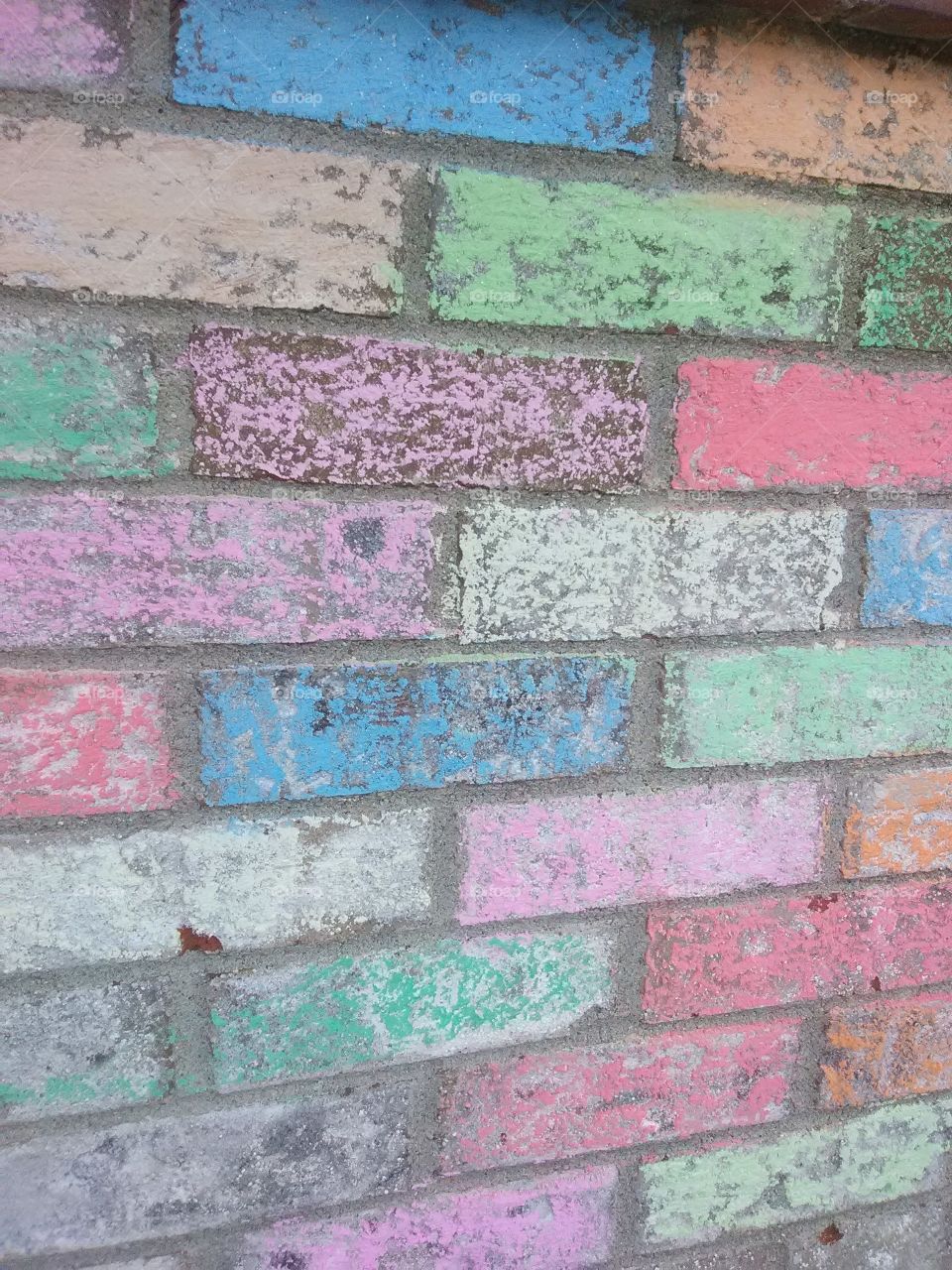 colorful color chalked brick really brighens a place up.