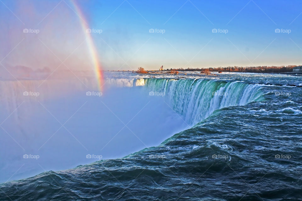 Rainbow over waterfall