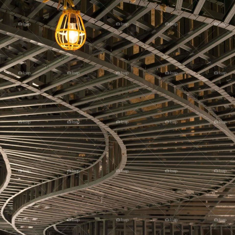 eye catching artistic patterns from unfinished ceiling work in a house under construction