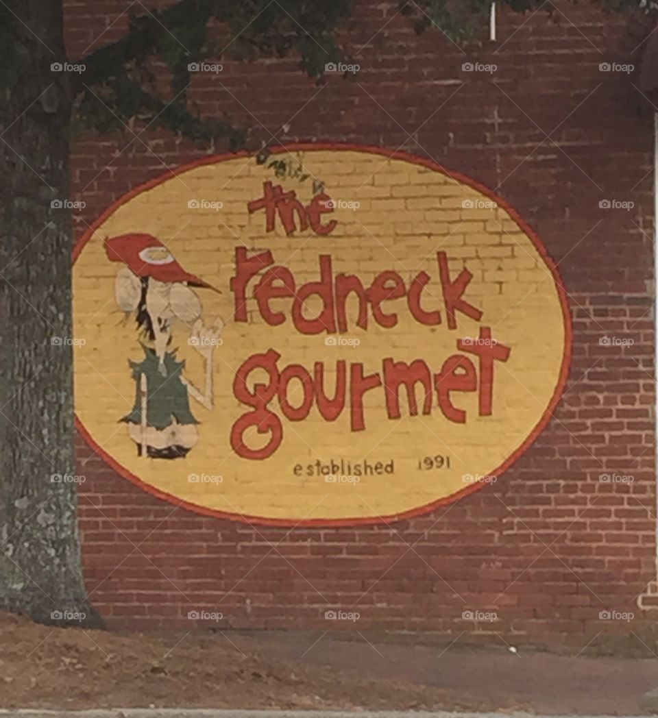 Painted sign on an old brick wall advertising Southern Food.