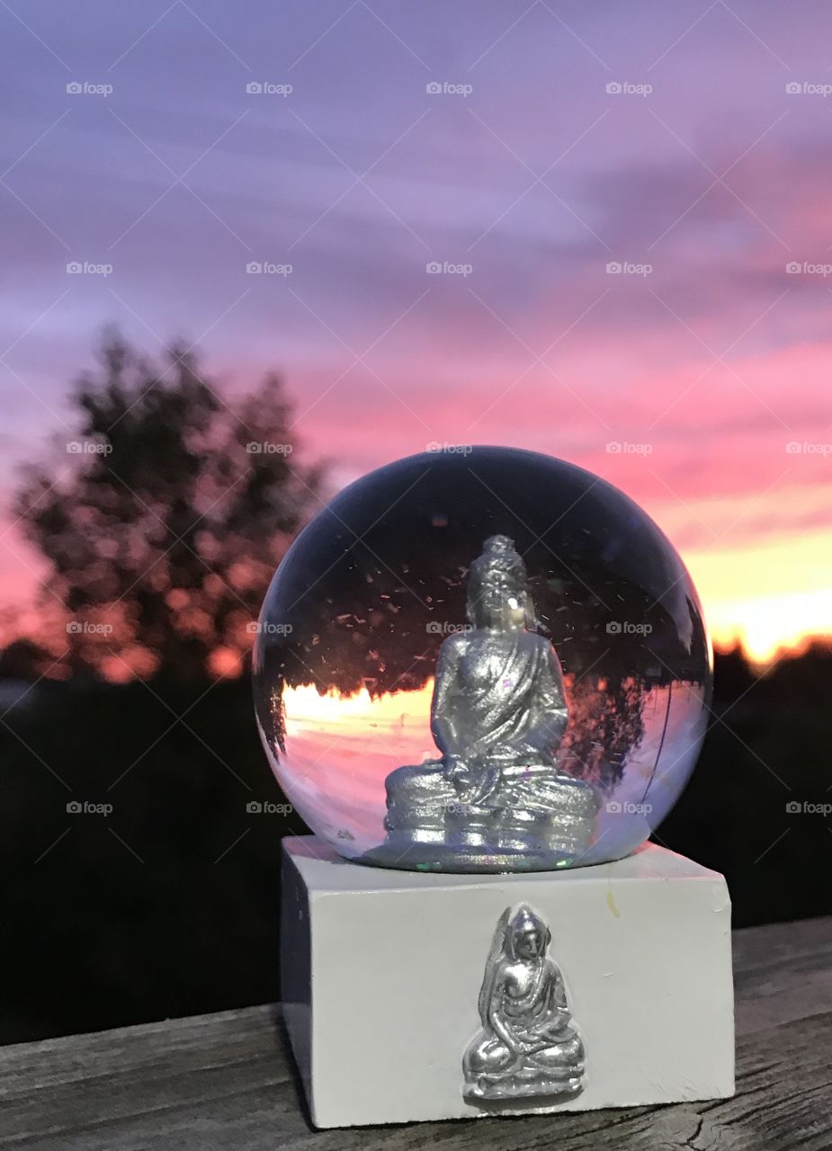 Crystal ball, sunset, Buddha 