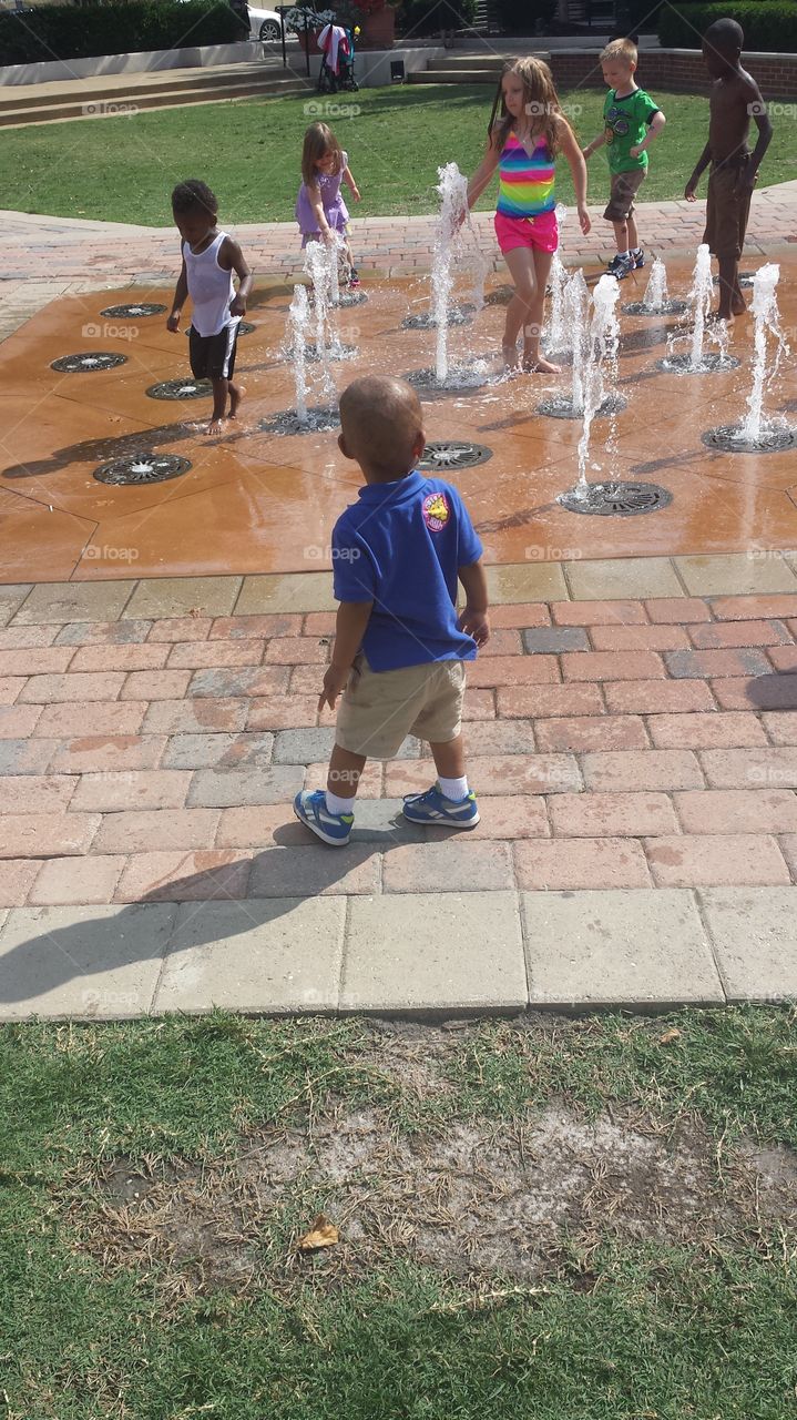 Decisions. Baby Jay debating on whether or not he wants to play in the fountain.