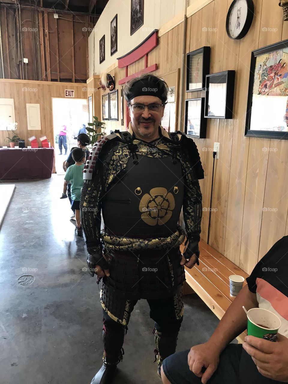 Happy to be clad in samurai armor during a special celebration at the Japanese martial arts dojo.