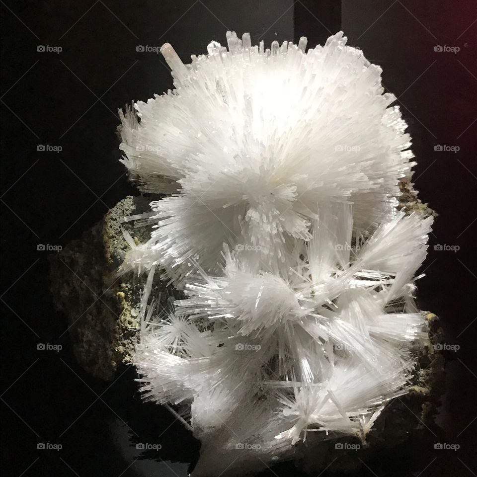 White crystal cluster on stone base