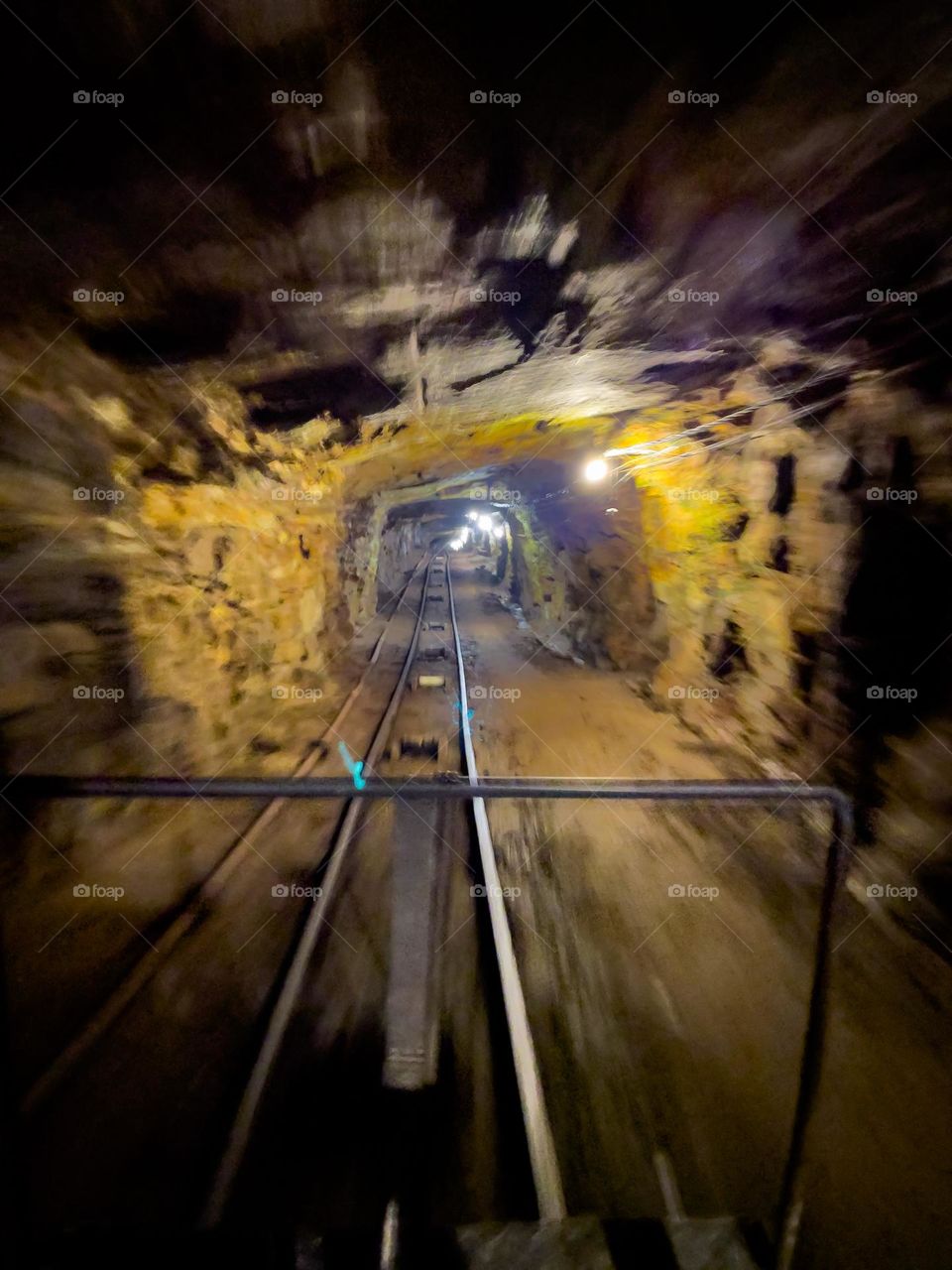 Speeding through a gold mine tunnel