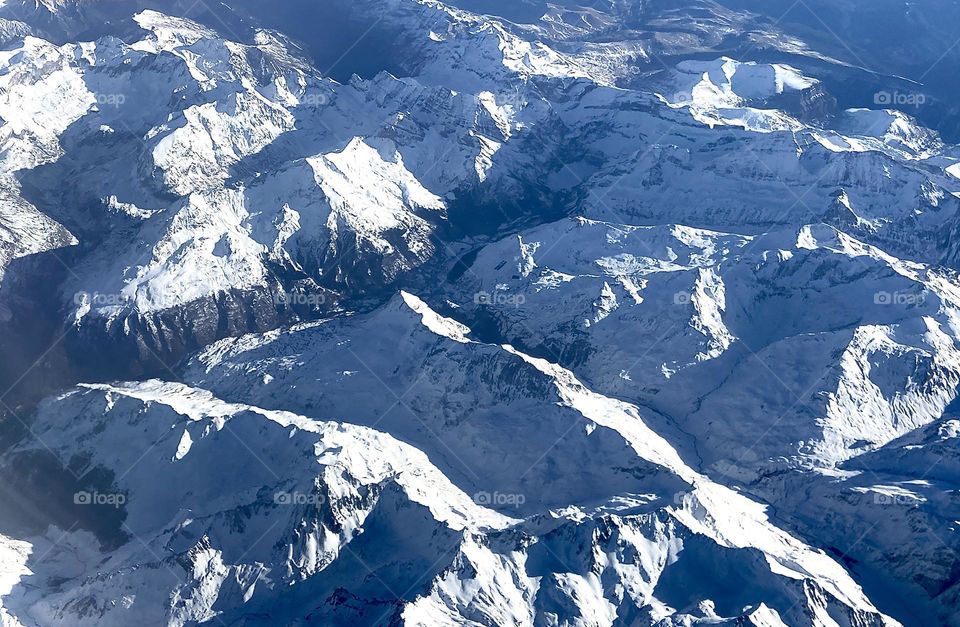 Snow-capped mountain range viewed from top