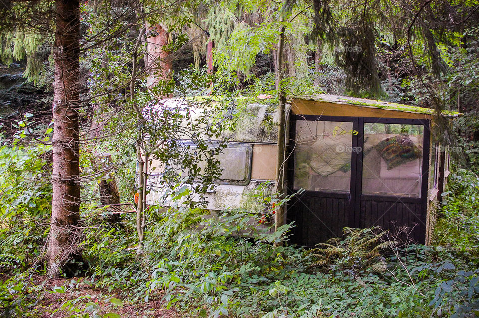 Abandoned caravan in the woods