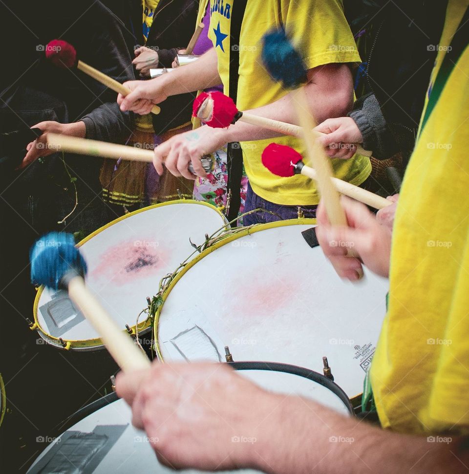 A group of people playing drums in a samba band 🪘