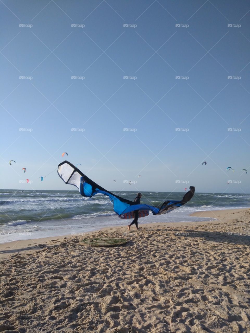 Kiteboarding is an action sport .
The power of the wind. Sea. Beach. Sunset