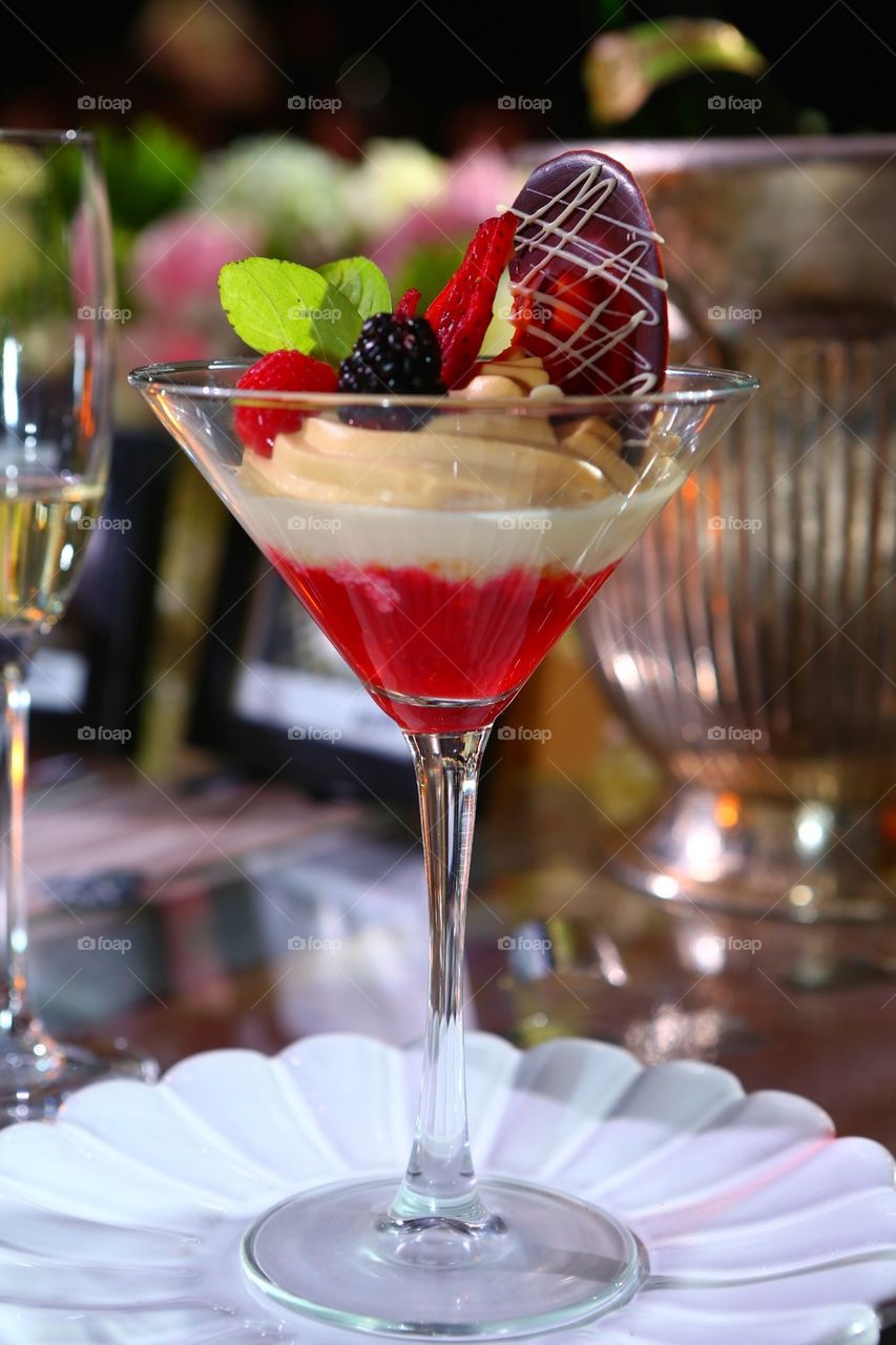 Berries and cream cheesecake in a cup