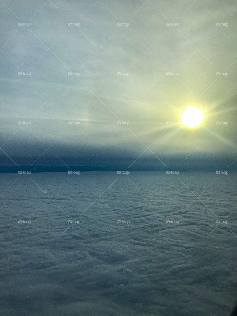 “Above the Clouds” A quilt made of clouds above the city of Bangalor, India. This photo captured with an Iphone 7 camera during winter from and airplane