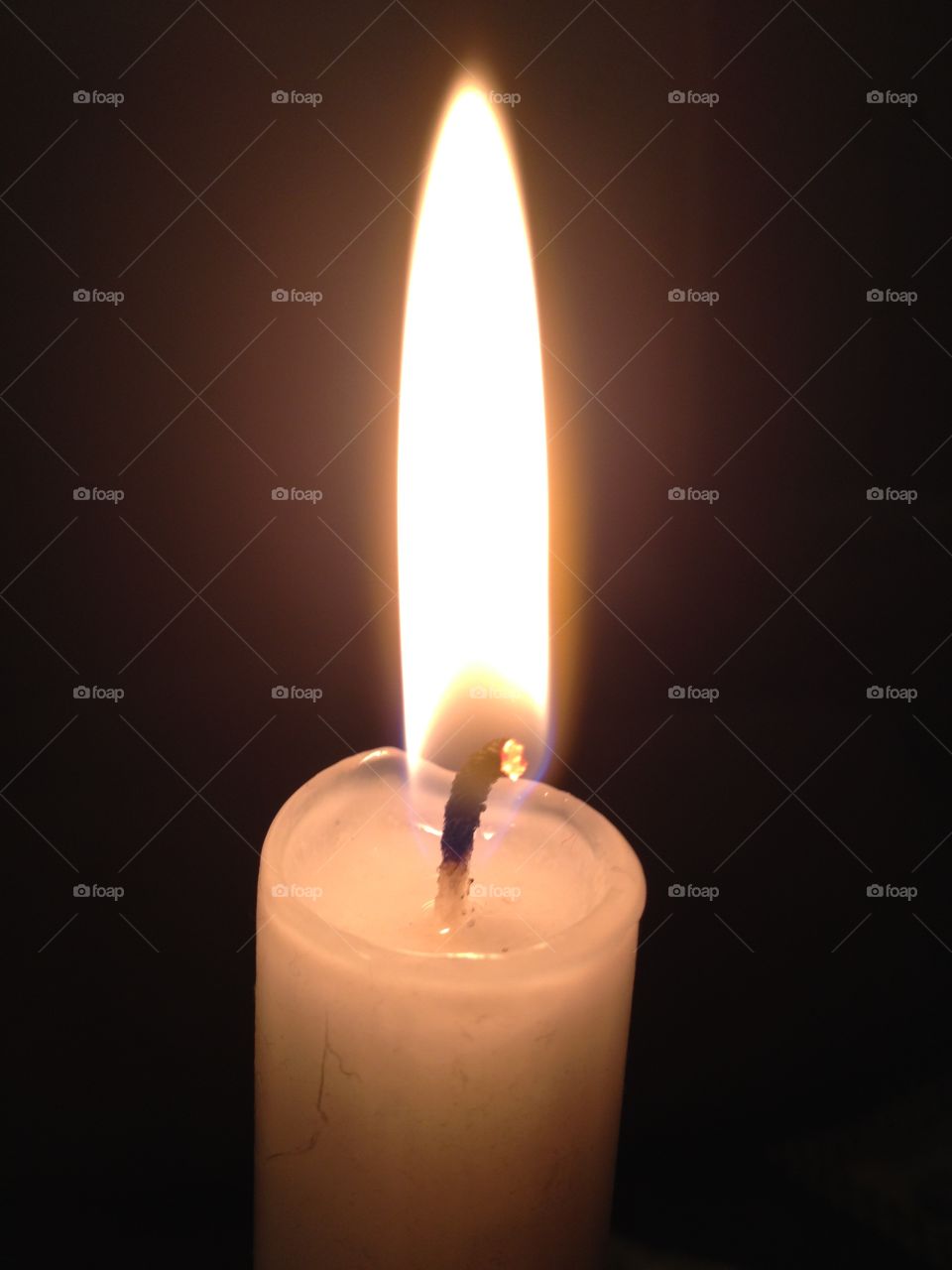 Flame. The flame of a single candle