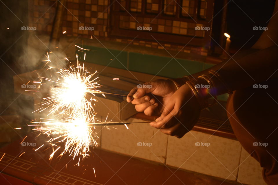 Two Sparking Kambi Mathappu on Hands