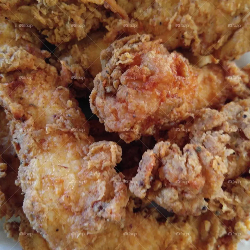 Fried Chicken. The barnyard pimp of the South. Mouth watering and delicious. I love to fry chicken. when it comes out of the dryer this pretty, I can't help but take a picture.