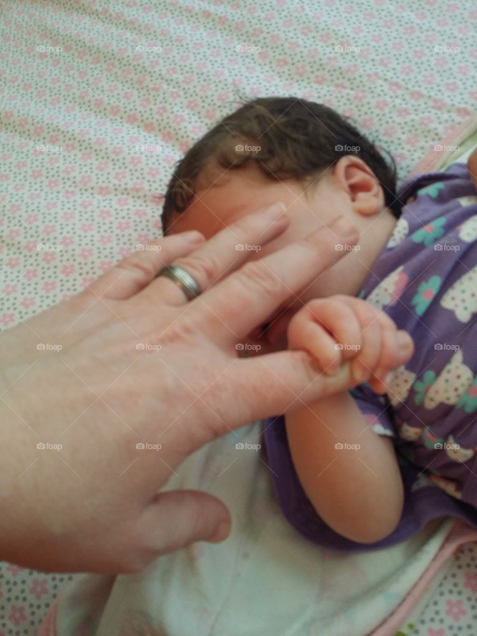 hand and baby