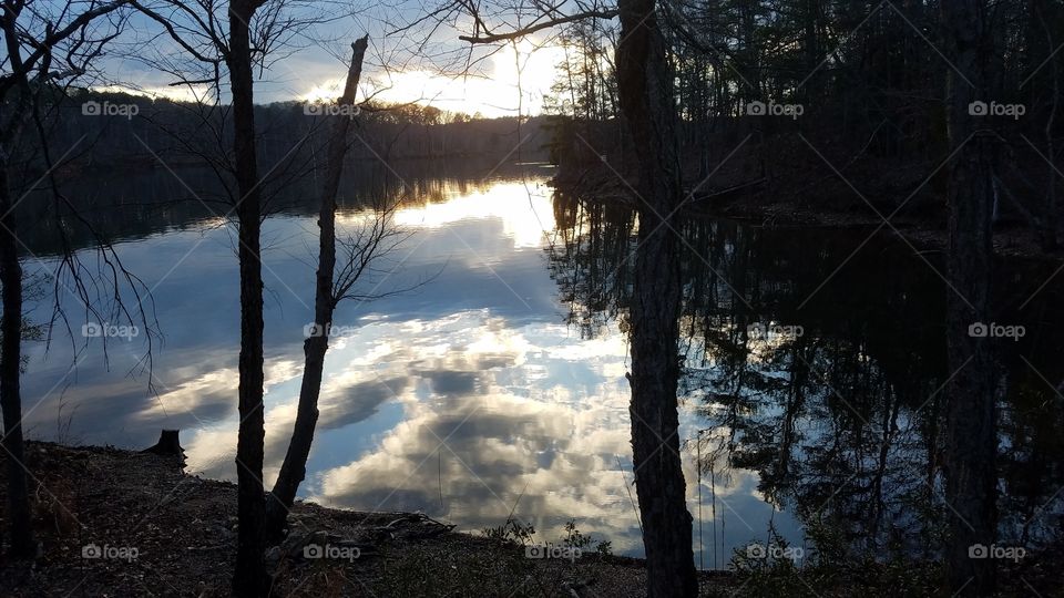 dusk on the lake, clouds reflecting on the water.