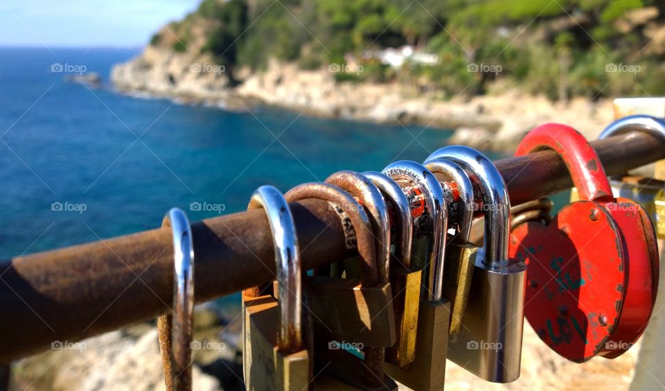 Locks with red heart. Group of locks in the beach in Lloret de Mar, Spain