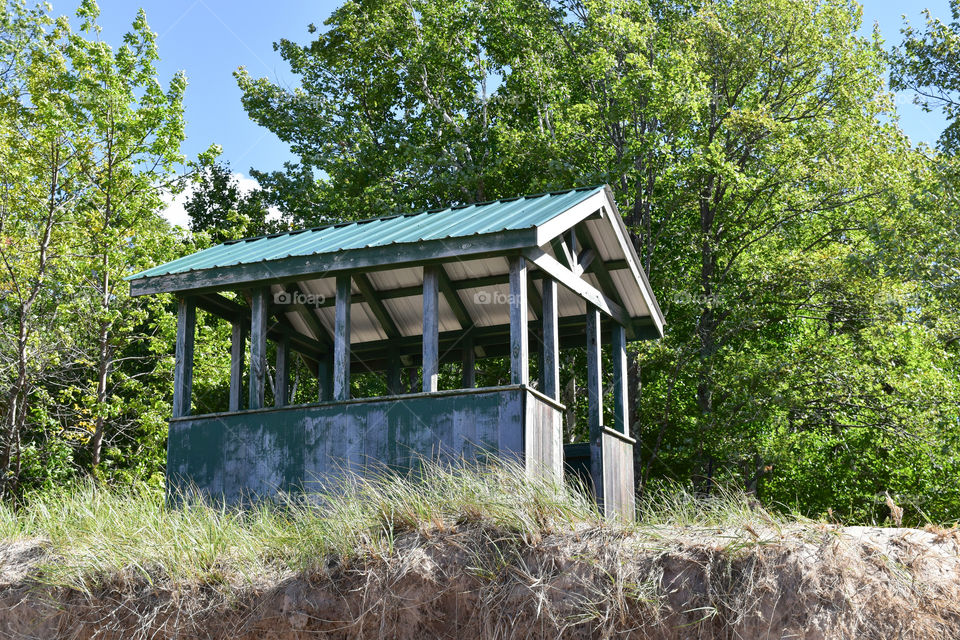 Beach shack perched on side of hill