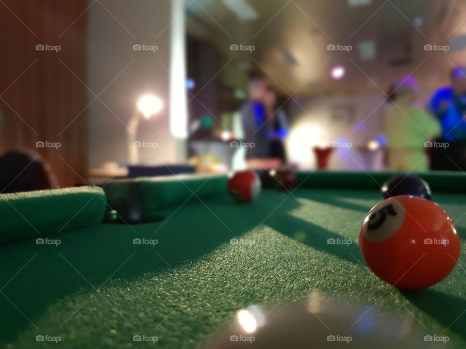 playing a game of pool