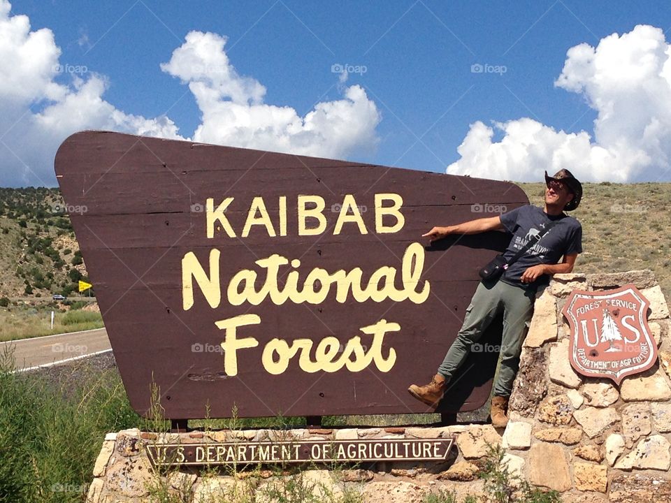 Man showing sign board, kaibab national forest, Arizona