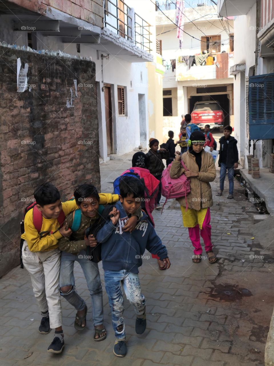 Children walking and playing on street