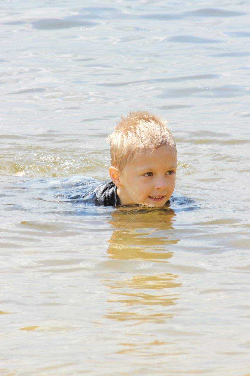 Boy swimming underwater