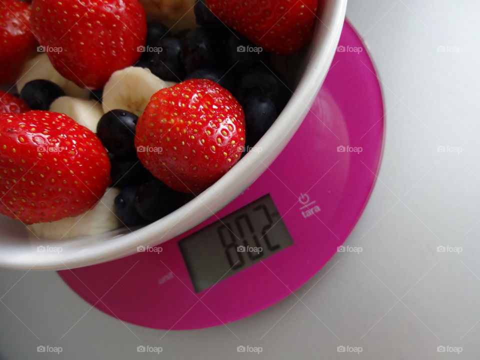 Healthy fruits breakfast full of vitamins with strawberry, banana and berries