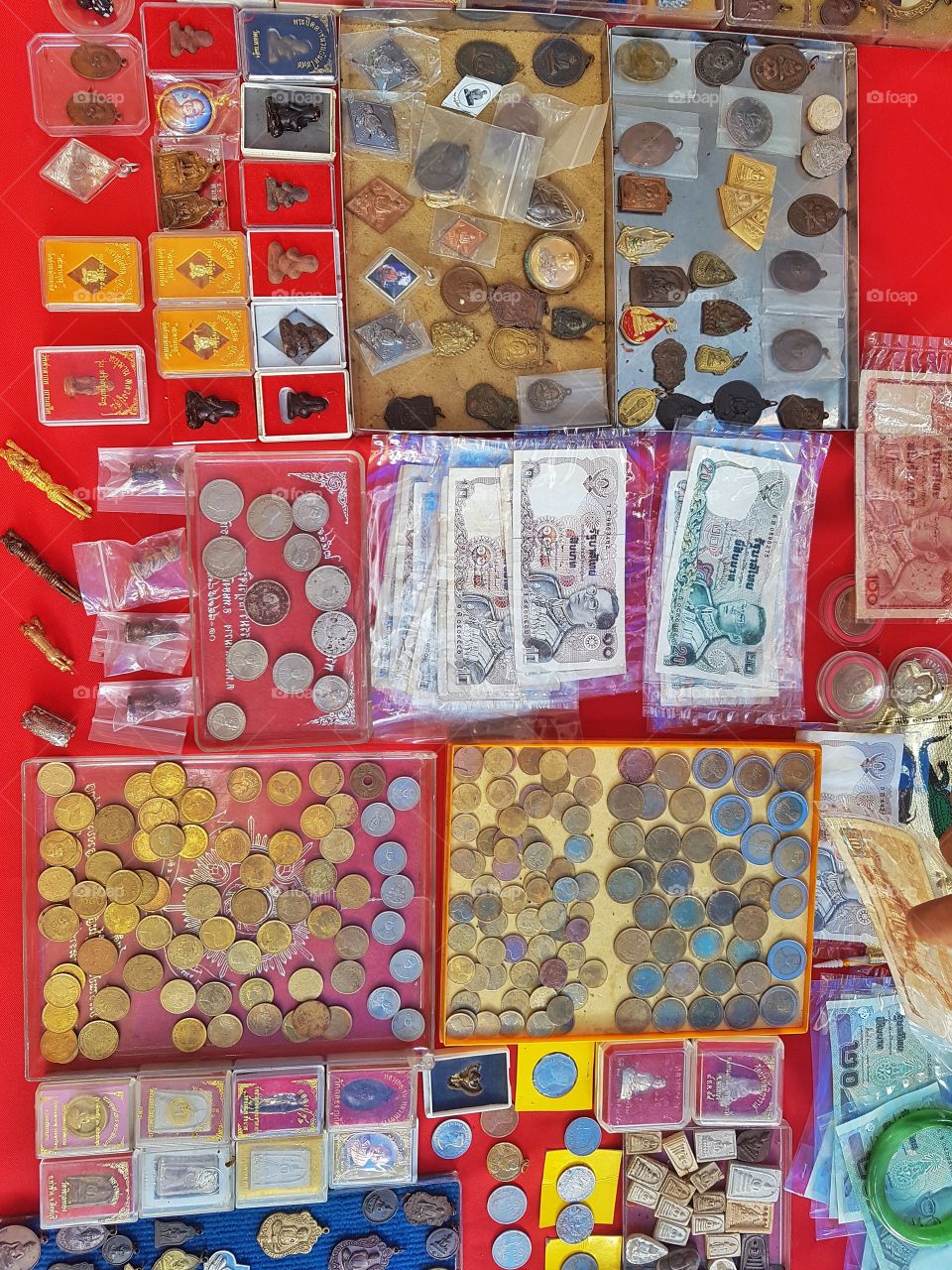 display of antique old Thai money coins and bank note at a flee market