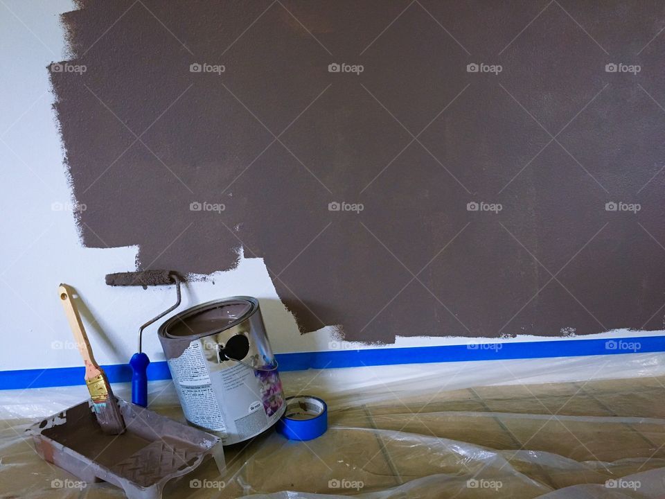 View painting equipment and brown paint wall