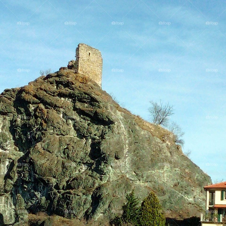 High ancient rock tower