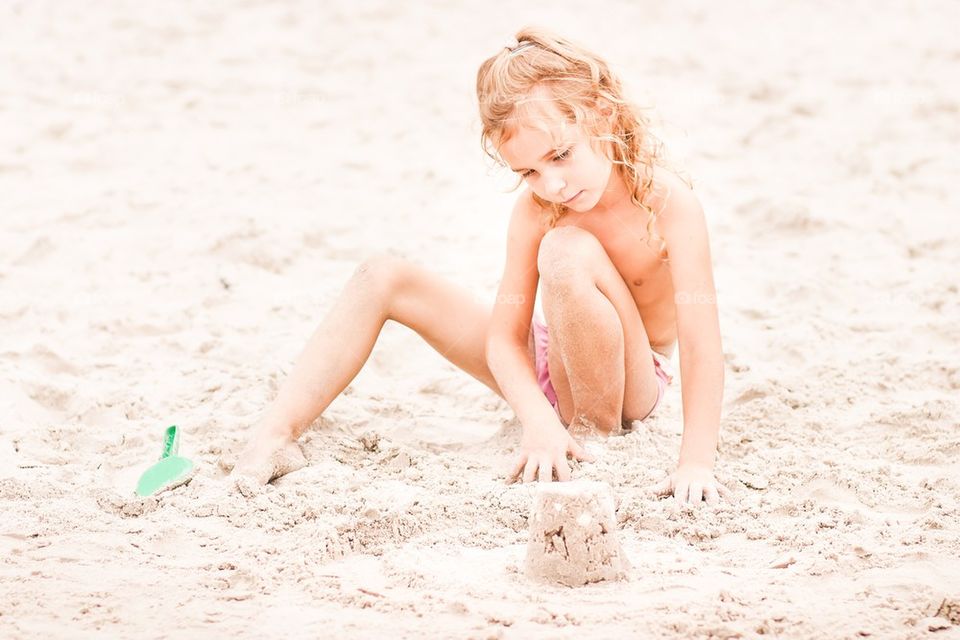 Girl playing on the beach