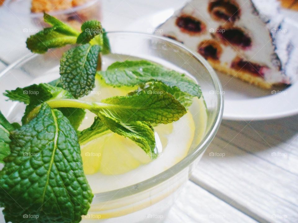 Homemade lemonade with lemon and mint leaves