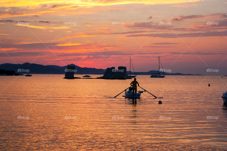 Scenic view of beach at sunset