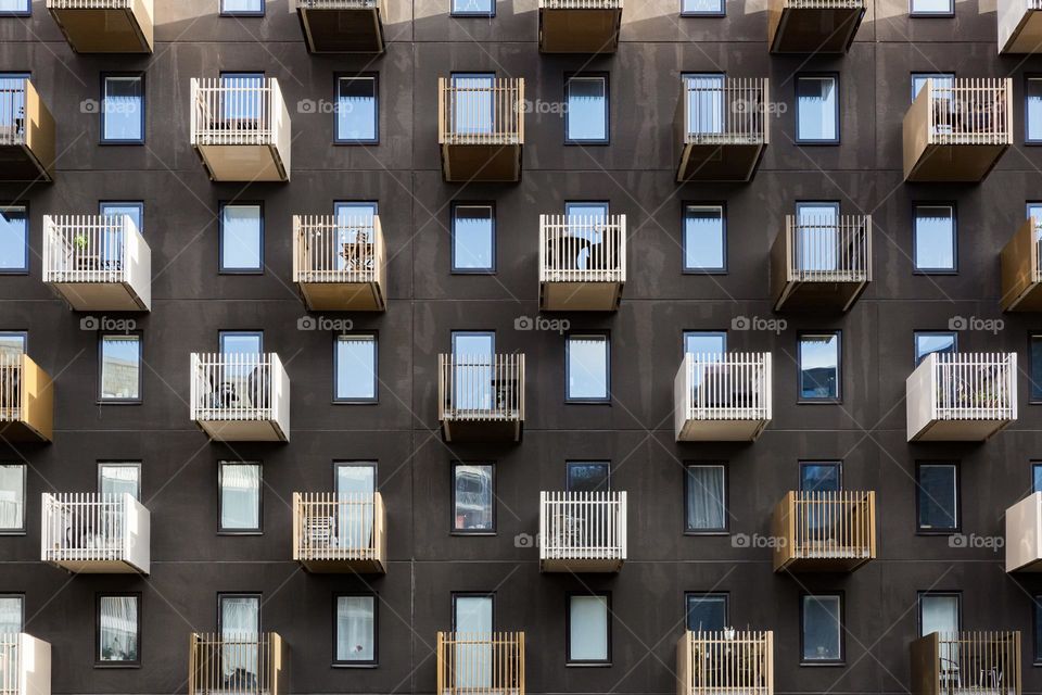 Rectangles and squares , windows and balconies on a big house 