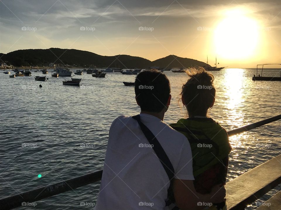 Enjoying the best of summer. After a day at the beach, there’s nothing better than watching the sunset from the pier 