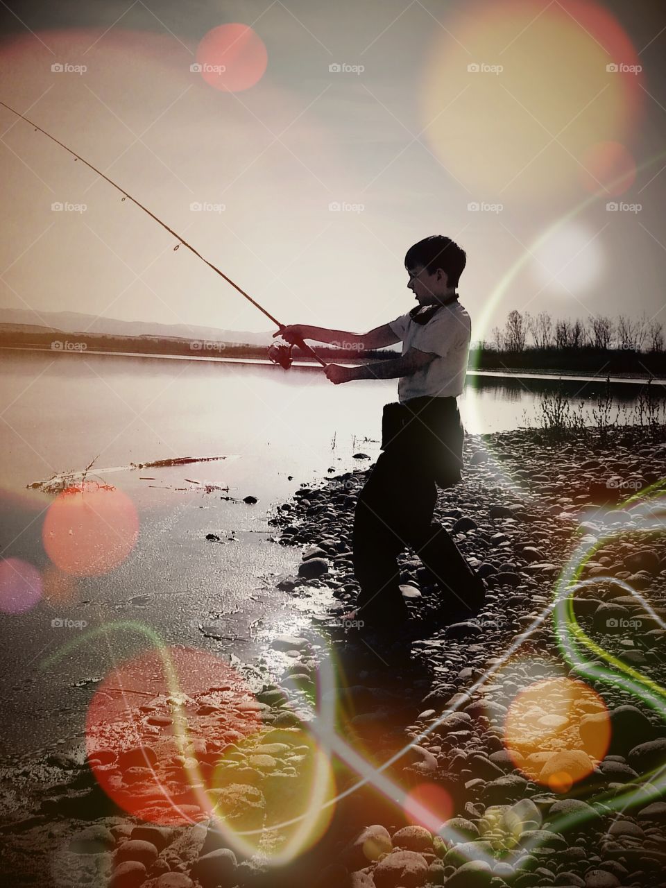 Fishing. My son, fishing in a lake, in Idaho.