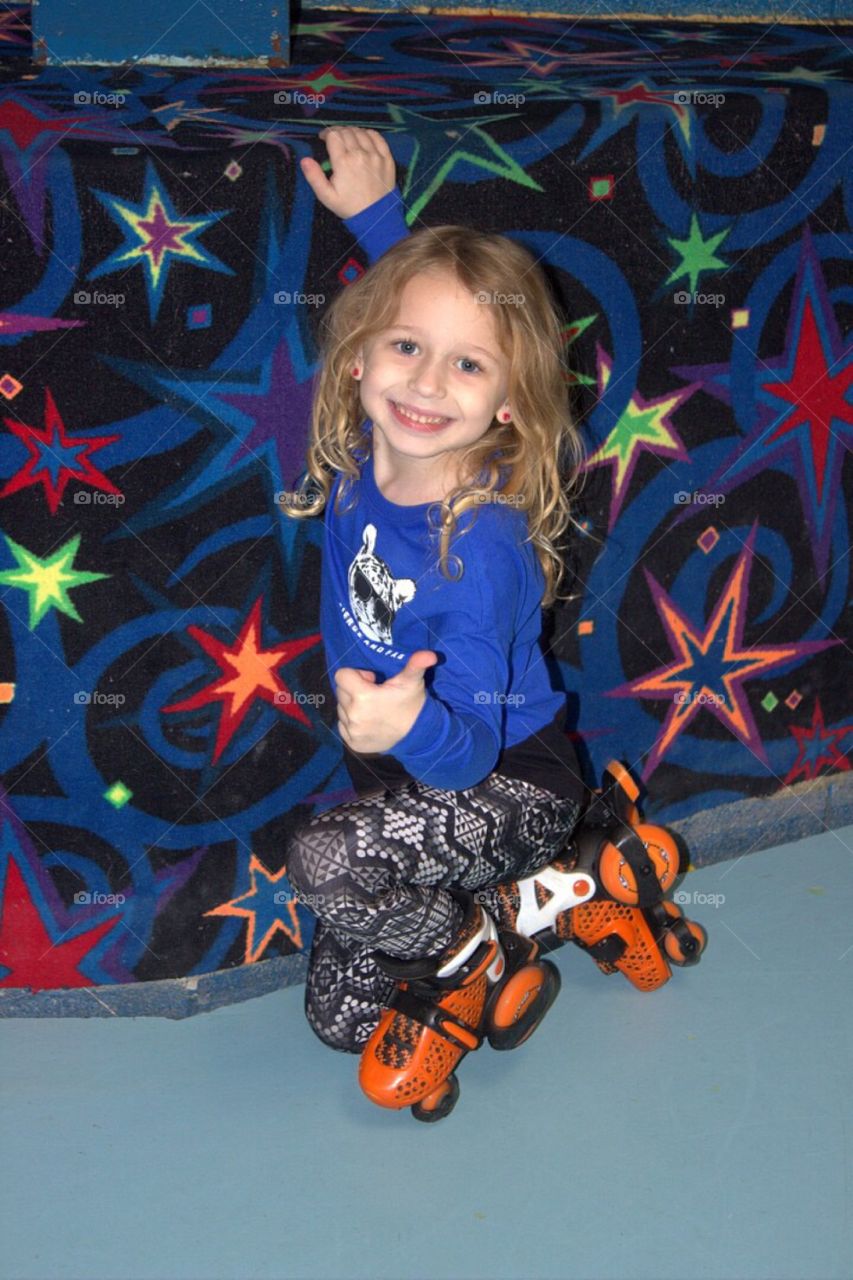 Close-up of a cute girl with skates