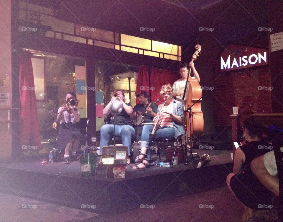 A jazz/bluegrass band performs at The Maison on Frenchwomen Street in Mew Orleans.