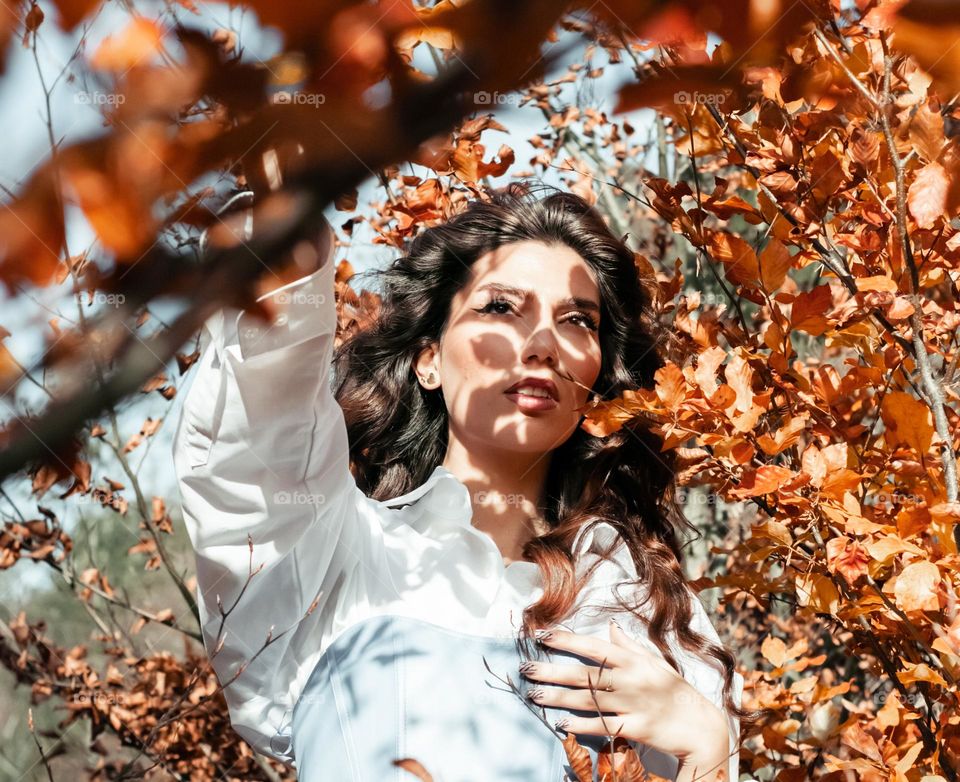 gorgeous portrait of a woman in the autumn forest