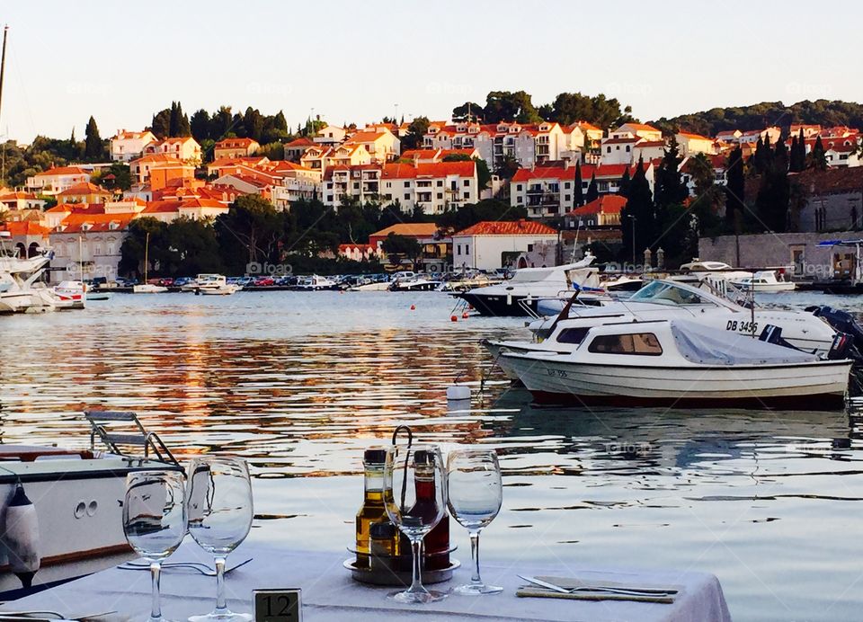 Dining alfresco at sunset . Enjoying a sunset seafood dinner at a  marina in Dubrovnik Croatia 