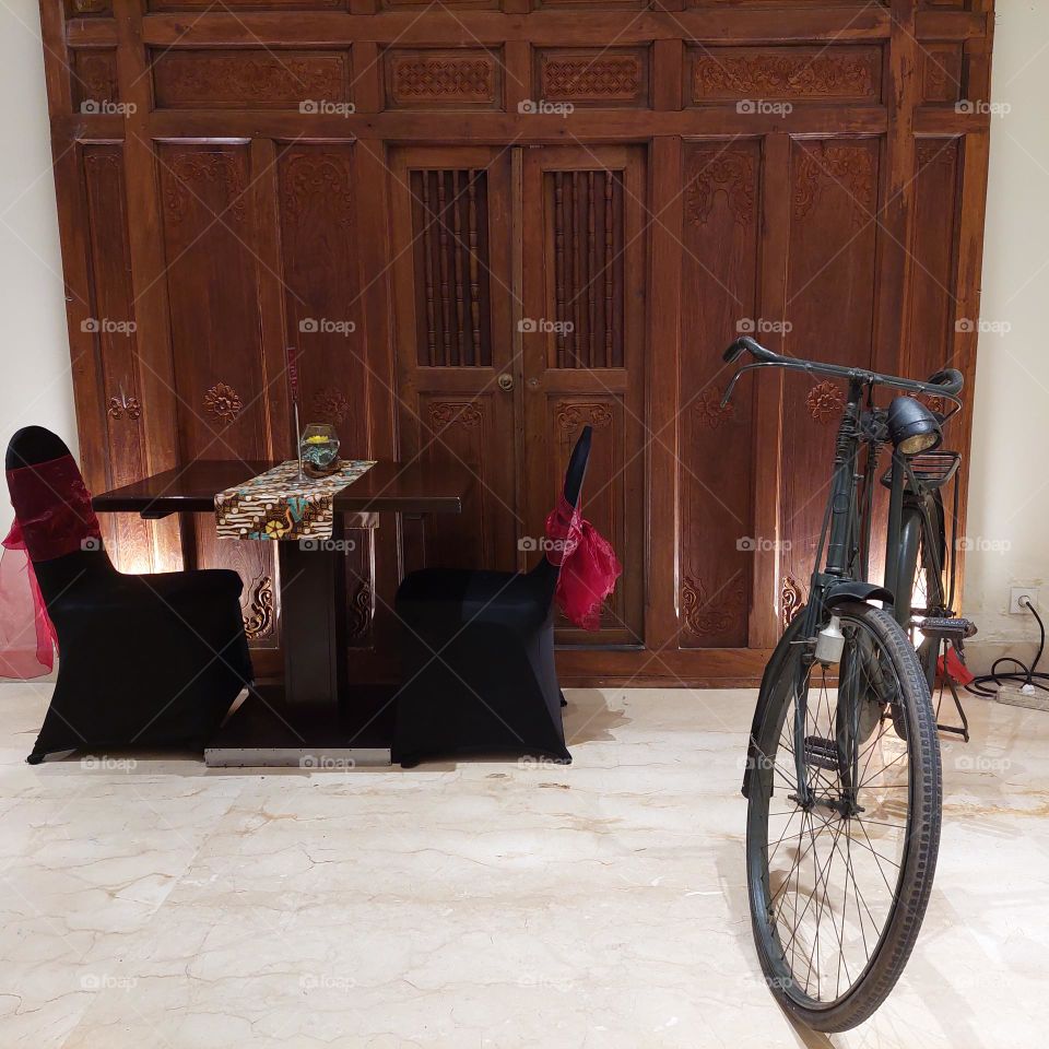 ancient door decoration and old bicycle