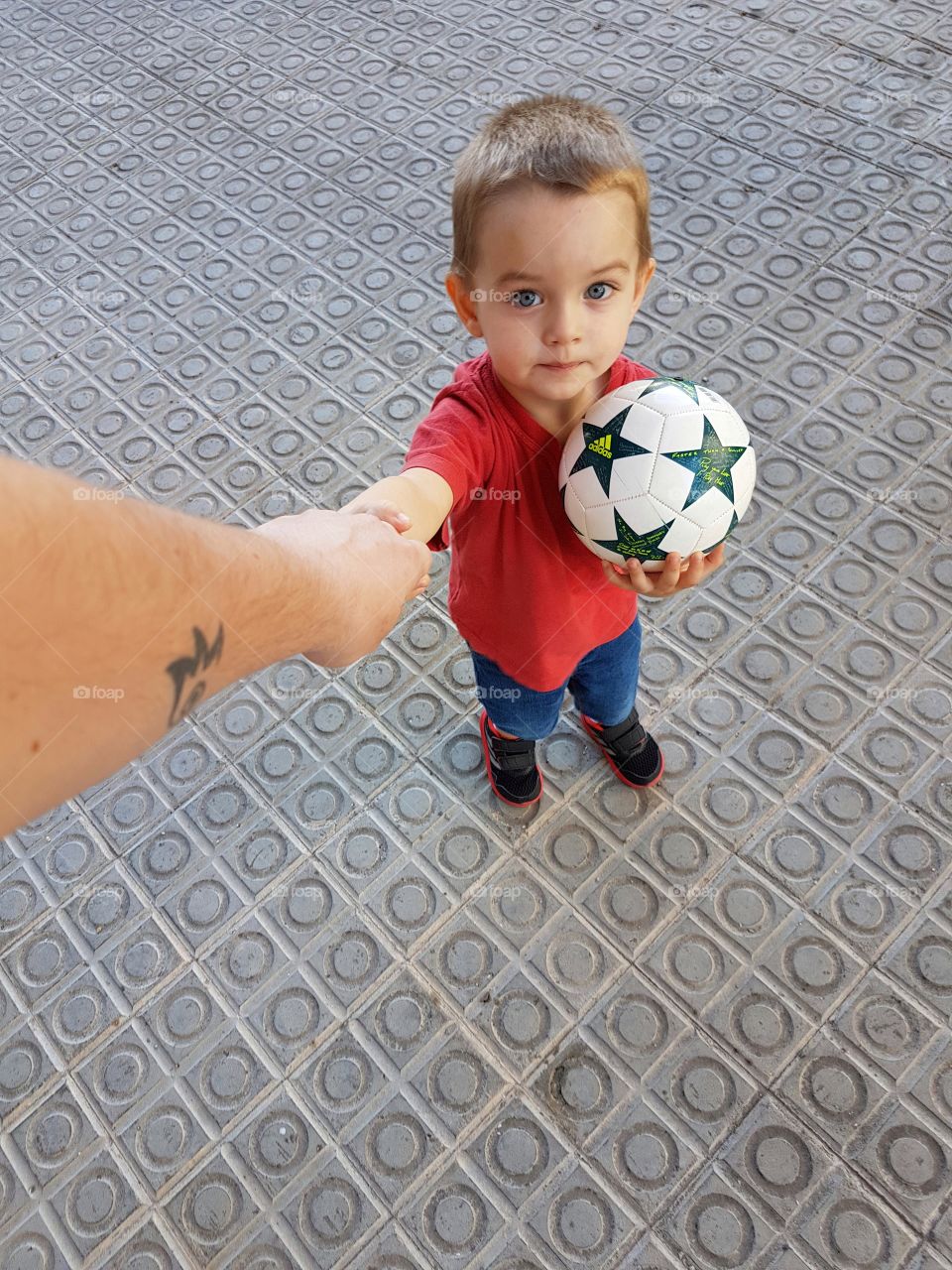 Cute boy holding ball