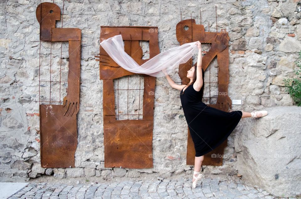 Young Female Ballerina Dancing Outside with Scarf